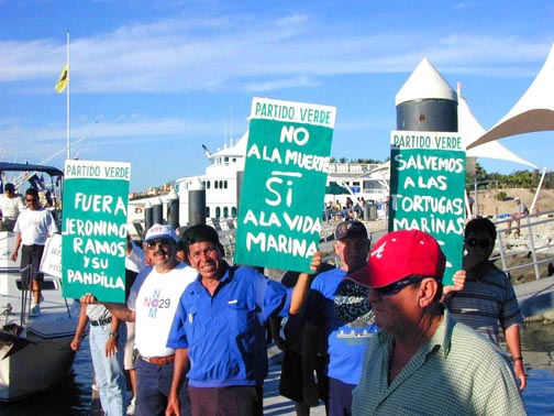Photo of protest signs at Cabo San Lucas, Mexico.
