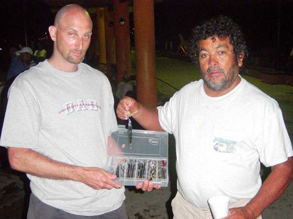 Photo of Luis Maciel and Jan Gladstone with box of mystery jigs at Zihuatanejo, Mexico.