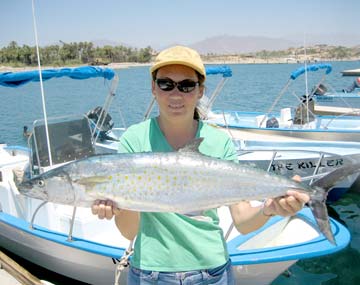 Mely Brictson with large sierra mackerel at San Jose del Cabo, Mexico.